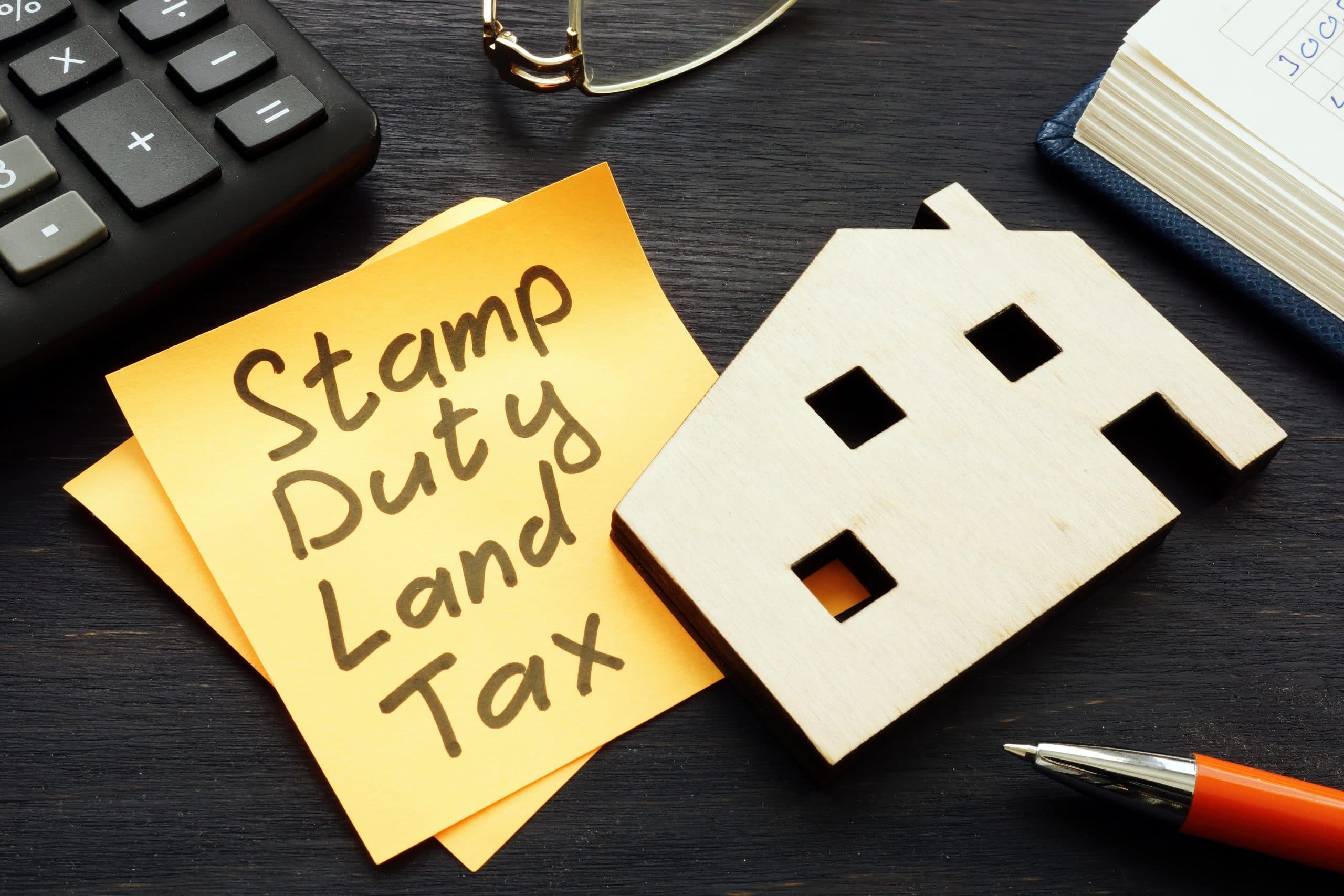 Stamp duty land tax SDLT memo and model of home.  Enact Conveyancing